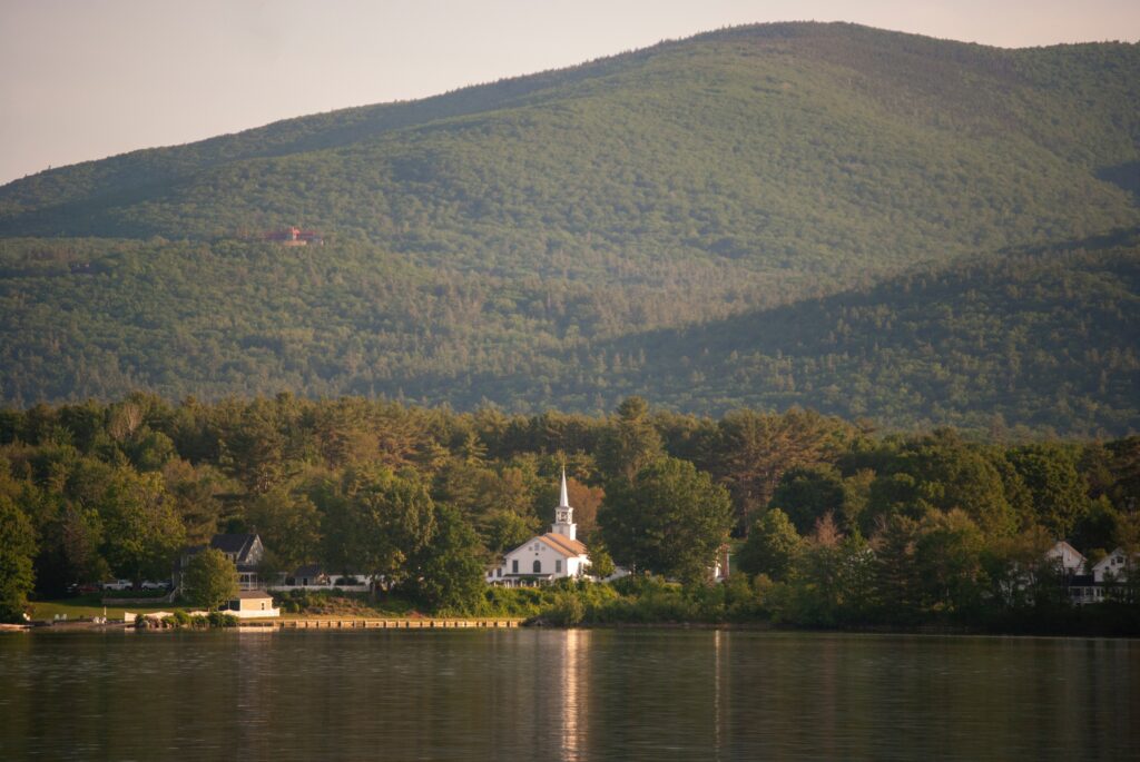 White Church Building Near the Mountain - New Hampshire Travel Guide
